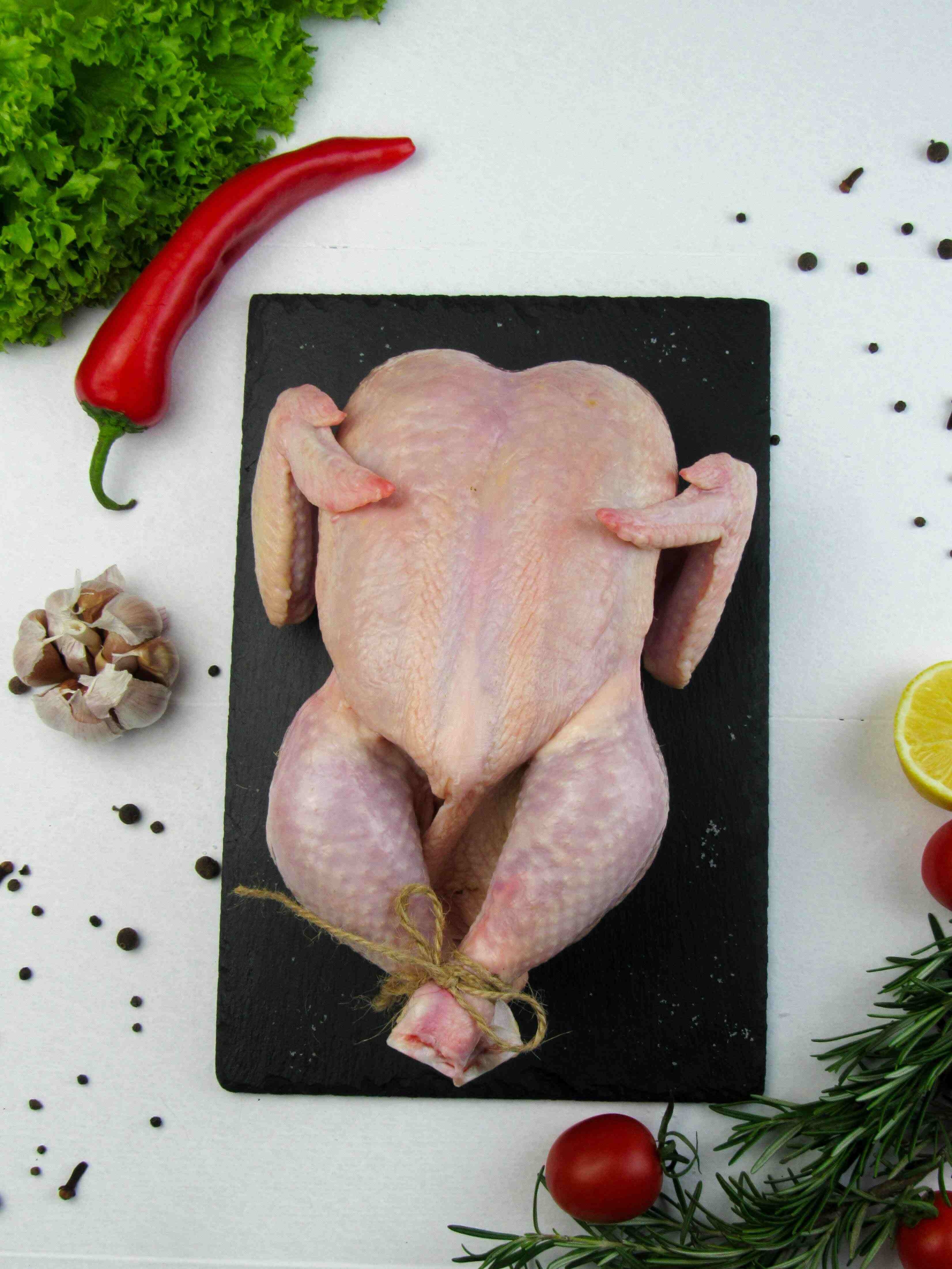 Whole free-range chicken with fresh herbs